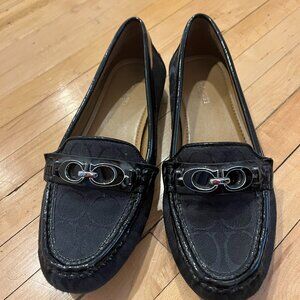 Black on black Coach loafers with silver detail